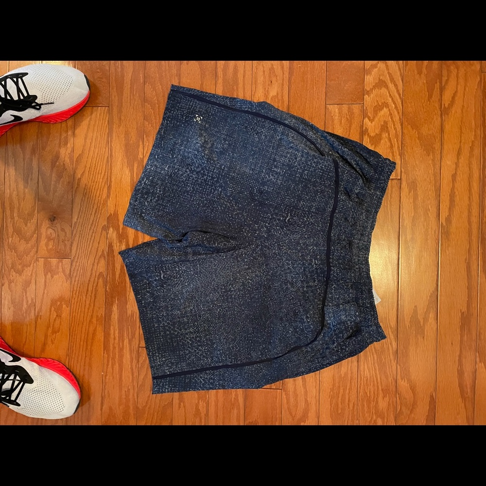Heathered Navy and grey shorts with liner. 9inch shorts have pockets as well. …